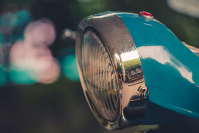 Cropped image of turquoise headlight