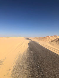 Scenic view of desert against clear sky