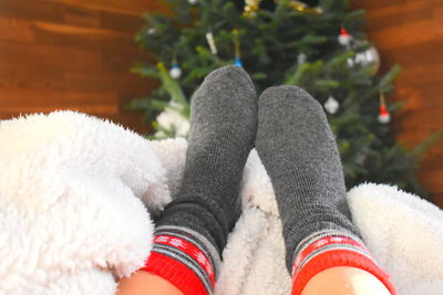 Low section of person relaxing on floor
