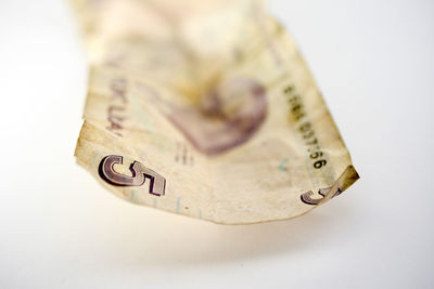 Close-up of ring over white background