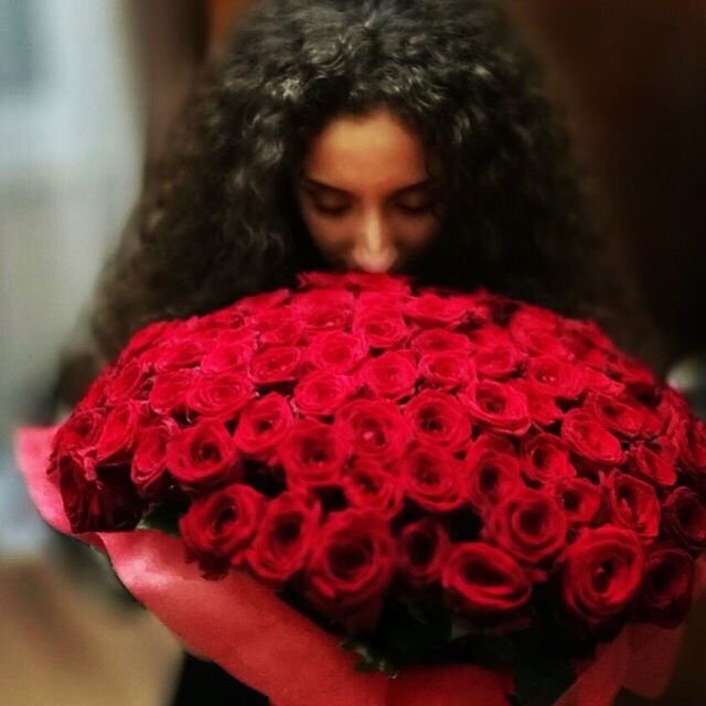 flower, red, one person, one woman only, headshot, beauty, women, only women, fragility, beautiful woman, close-up, freshness, adults only, people, adult, indoors, human body part, day