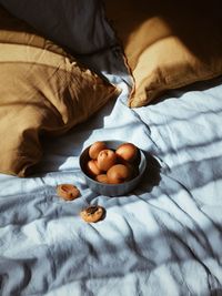 High angle view of fruits on bed