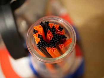 High angle view of orange juice in glass on table