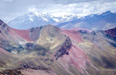 View of mountain range against cloudy sky