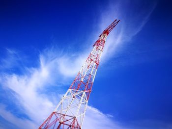 Low angle view of vapor trail against blue sky