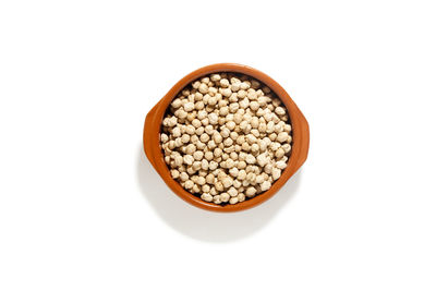 High angle view of bread in bowl against white background