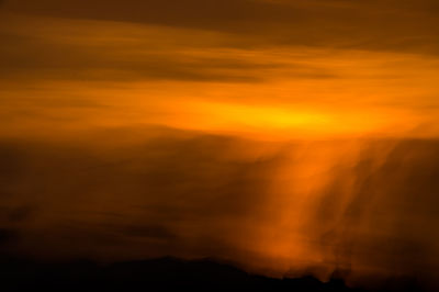 Scenic view of dramatic sky during sunset