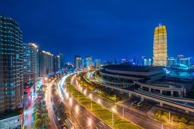 High angle view of illuminated cityscape against sky at night