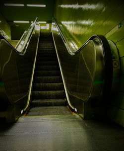 Lime green subway station escalator