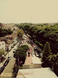 High angle view of trees and buildings against sky