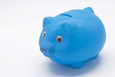 Close-up of blue toy against white background