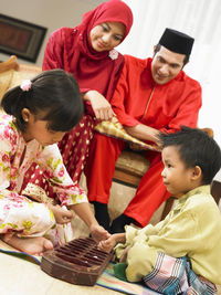 Family enjoying in living room during festival at home