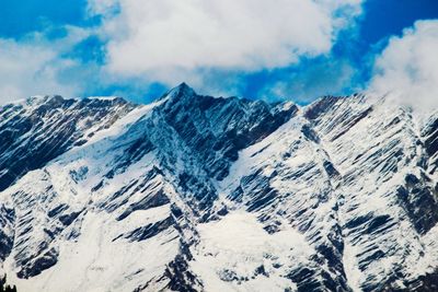 Scenic view of snow mountains against sky