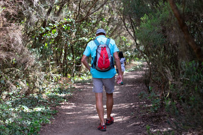 Full length of woman walking in forest