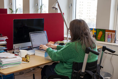 Disabled woman working in office