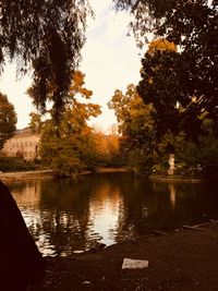 Scenic view of lake against sky at sunset
