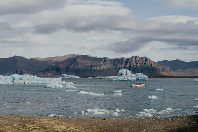 Boat with tourists in the jökulsárlón glacier lagoon in iceland