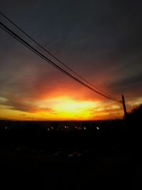 Silhouette landscape against sky during sunset