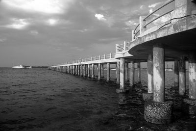 Pier over sea against sky