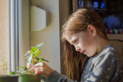 Portrait of girl looking at home