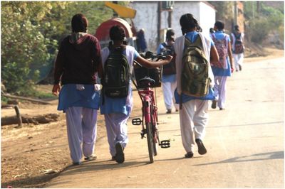 People on road in city