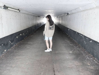 Woman standing on the road