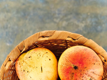 Close-up of mangoes in wicker basket