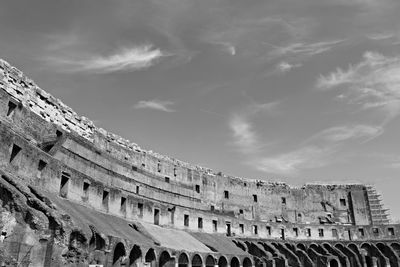 Low angle view of coliseum against sky