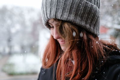 Close up of girl smiling in the snow