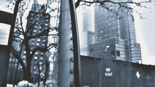 Buildings seen through glass window