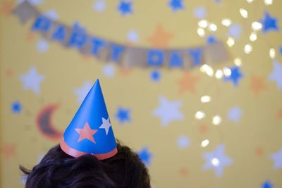 Low angle view of flags against colored lights