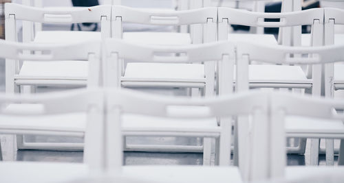 Close-up of chairs on table