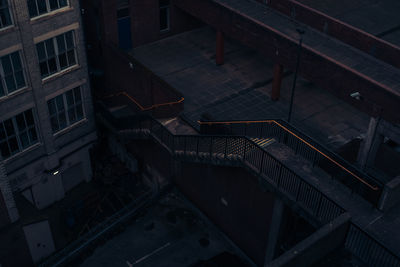 High angle view of staircase in city at night