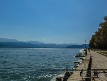 Scenic view of sea against clear blue sky