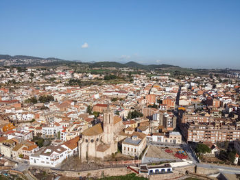 Aerial view of caldes de montbui and its church santa maria. medieval village in catalonia, spain