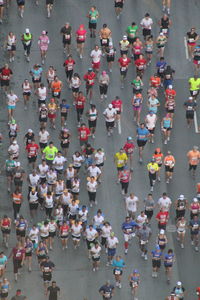 High angle view of crowd running on road during marathon in city