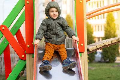 Portrait of smiling boy playing in playground