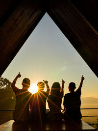 A family silhouette success inspiring suring the sunset