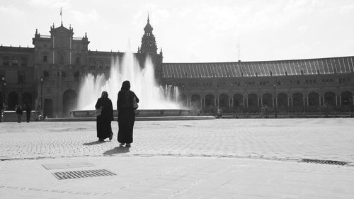 Full length of woman standing in city
