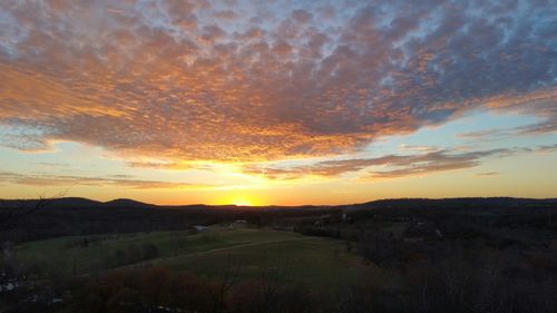 Scenic view of landscape against sky during sunset