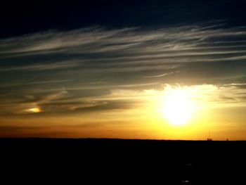 Scenic view of landscape against sky at sunset