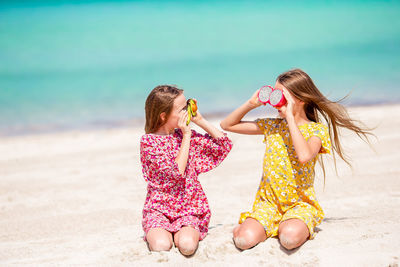 Rear view of girl on beach