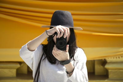 Woman photographing through camera