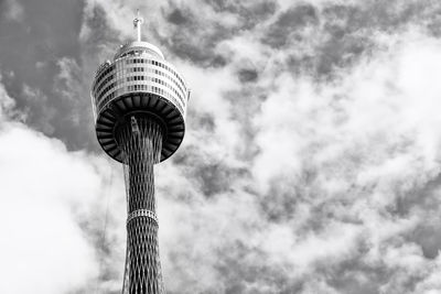 Low angle view of tower against cloudy sky