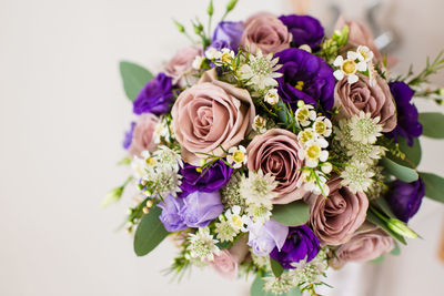 Close-up of flower bouquet against white background