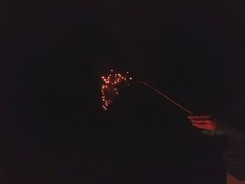 Low angle view of firework display at night