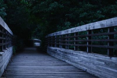 Footbridge against trees