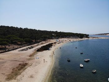 Scenic view of beach against clear sky