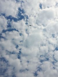 Low angle view of airplane flying in sky