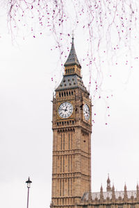 Low angle view of clock tower against sky